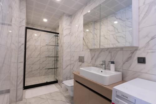 a bathroom with a sink and a shower and a toilet at Villa Tutar 1 Marmaris Daily Weekly Rentals in Muğla