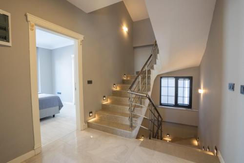 a staircase in a house with lights at Villa Tutar 1 Marmaris Daily Weekly Rentals in Muğla