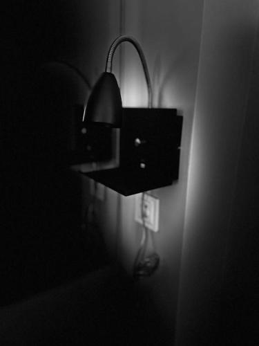 a light on a wall in a dark room at Hotels-Widok Rynek - Centrum &Parking -fak VAT in Kielce