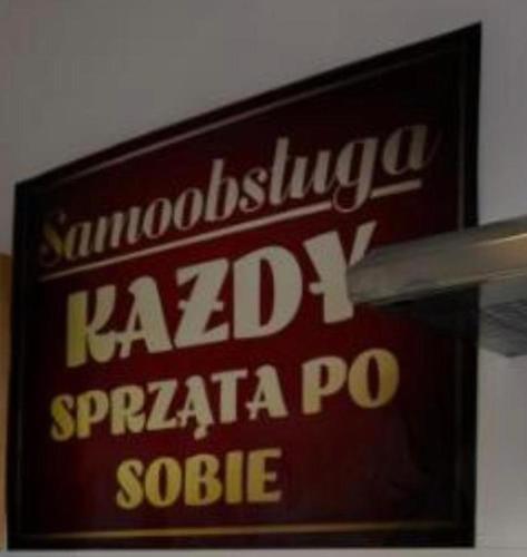 a sign for a kalamaja pasta po on a wall at Hotels-Widok Rynek - Centrum &Parking -fak VAT in Kielce