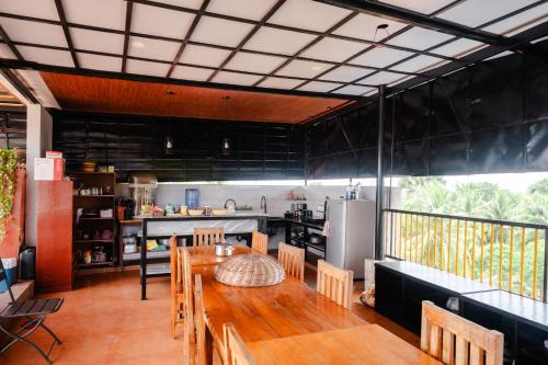 a kitchen and dining room with a table and chairs at Florencia's Inn in Panglao