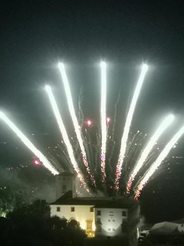 a group of lights in the sky at night at Mezzomonte View in Impruneta