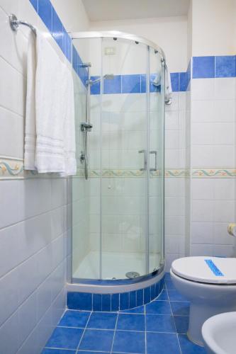 a bathroom with a shower and a toilet at Hotel Centro Congressi Polo Nautico in Salerno