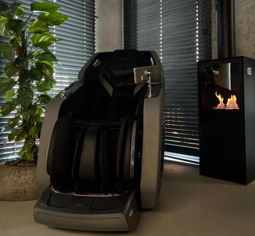 a food processor sitting on a counter next to a fireplace at Premium Apartament & Spa in Zator
