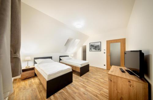 Postel nebo postele na pokoji v ubytování Pihel Apartments