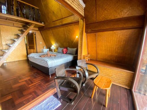 Postel nebo postele na pokoji v ubytování Modtanoi Paradise Homestay