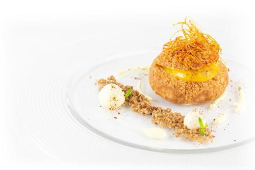 a white plate with a dessert on it at Casa De Campo in Mosciano SantʼAngelo