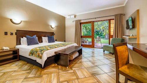 Krevet ili kreveti u jedinici u okviru objekta Hotel Numbi & Garden Suites
