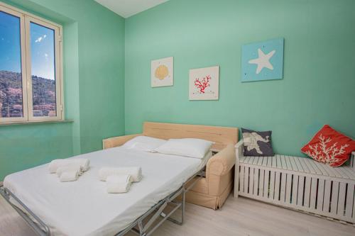 Ένα ή περισσότερα κρεβάτια σε δωμάτιο στο Una Finestra Sul Mare