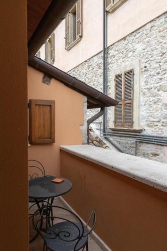 a balcony with two chairs and a table on a building at Hotel & Residenza 100 Torri in Ascoli Piceno