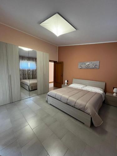 a bedroom with a large bed in a room at ROOM365 in Lanciano