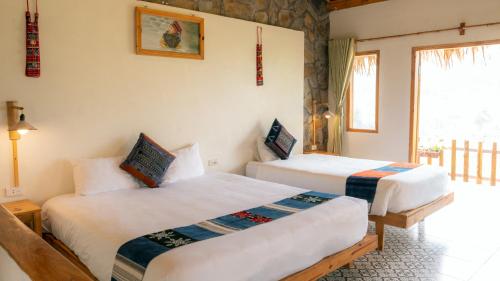 Letto o letti in una camera di Sapa Eco Bungalows & Spa