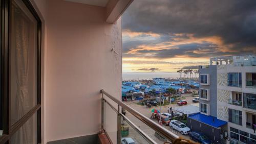 a balcony of a building with a view of a city at Hotel New Sagar Priya in Digha