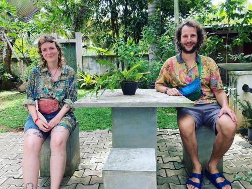 a man and a woman sitting at a table at The Mango Leaf in Matara