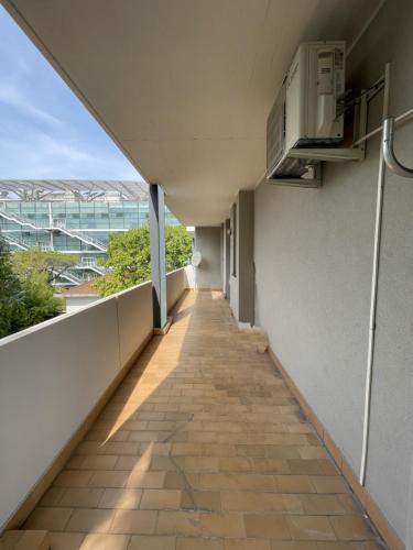 an empty hallway of a building with a balcony at La Romantica in Riccione