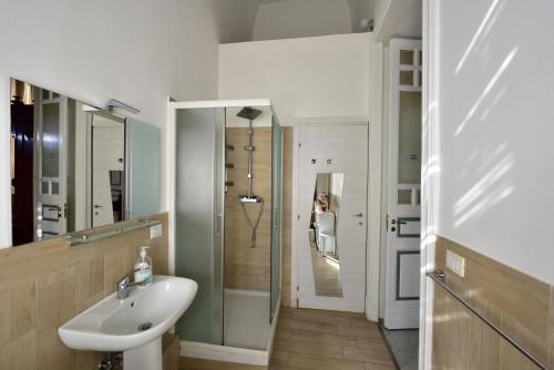 a bathroom with a sink and a shower at A Casa Di Laura in Catania