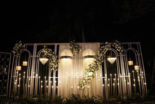 a gate with lights and a bunch of lights at Goa Country Club Near Park Hospital BY Pearl I Luxury resort in Gurgaon in Gurgaon