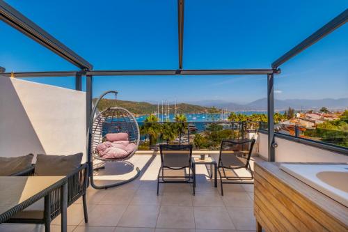 a balcony with a view of the water at Nakas Suites in Fethiye
