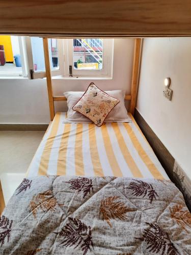 Cama o camas de una habitación en Be Happy HomeStay