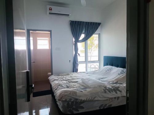 a bedroom with a bed and a window at Razak City Centre KL SkyView 45th in Kuala Lumpur