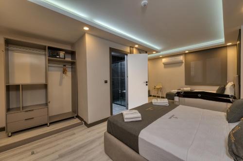 a bedroom with a large bed and a bathroom at Swans Hotel Old City Grand Bazaar in Istanbul