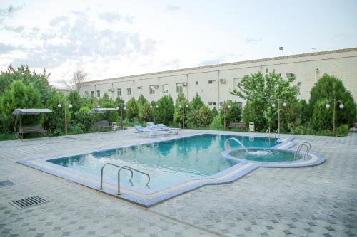 a large swimming pool in a building at QiBLA TOZABOG in Khiva