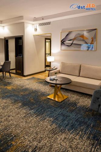 a living room with a couch and a table at Odst Jeddah in Jeddah