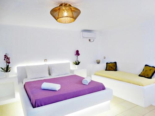 Ένα ή περισσότερα κρεβάτια σε δωμάτιο στο Mykonian Breeze