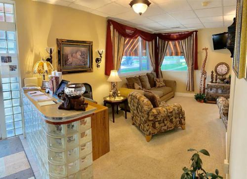 a living room with a couch and a table at Monroe Street Suites in Pittsfield