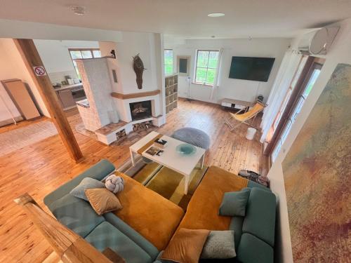 an overhead view of a living room with a couch at Farm hostel - The hause 1 in Elektrėnai