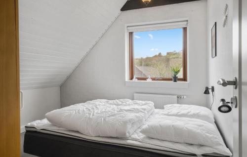 a white bed in a room with a window at Pet Friendly Home In Lemvig With Wifi in Lemvig