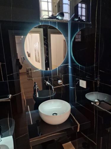 a bathroom with a sink and a mirror at DoMa house b&b in Nocera Inferiore