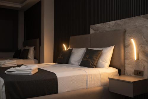 a hotel room with a large bed with towels on it at Swans Hotel Old City Grand Bazaar in Istanbul