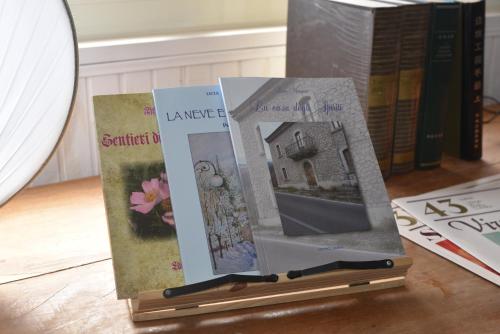 three books sitting on top of a table at O' Frechete! in Sulmona