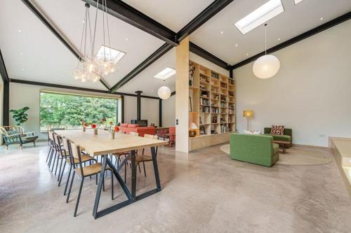 a dining room and living room with a table and chairs at Luxury Eco Escape in South Devon in Darlington