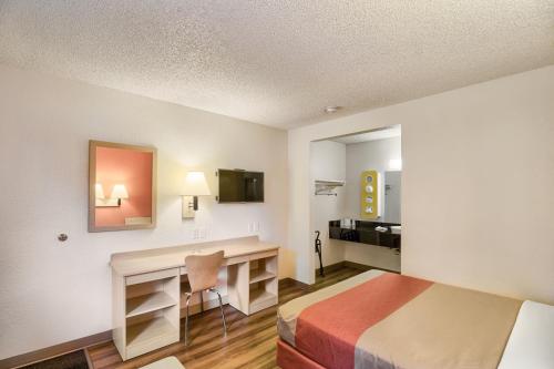 a hotel room with a bed and a desk at Motel 6-Everett, WA - South in Everett