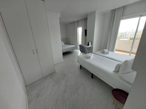 Hotel Aromarにあるベッド