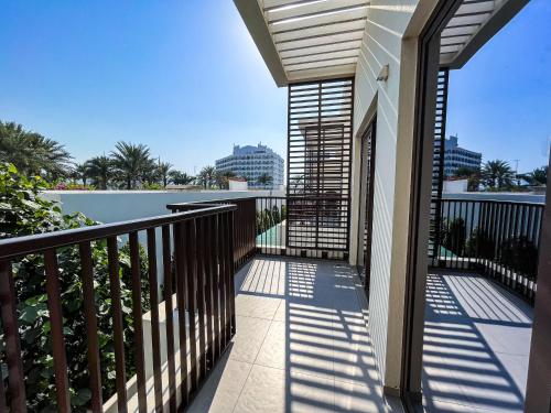 a balcony of a house with a view of the ocean at Luxury Villa by the sea in Fujairah