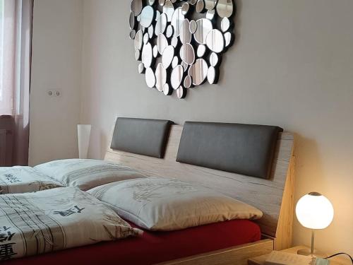 a bedroom with two beds and a chandelier at Apartment 66 in Bressanone