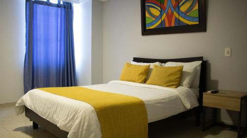 Postel nebo postele na pokoji v ubytování HOTEL PLAZUELA REAL