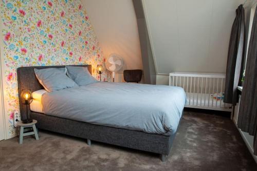 Postel nebo postele na pokoji v ubytování Netjes appartement in buiten gebied, Landelijk