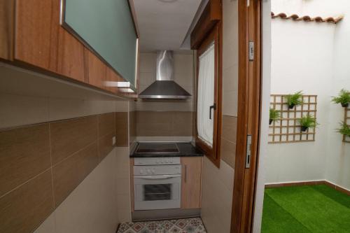 Dapur atau dapur kecil di Tu Refugio en la plaza Mayor