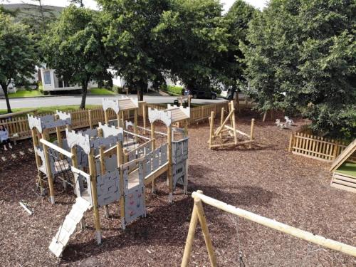 a playground with a slide in a park at Number 57 Brynteg in Caernarfon