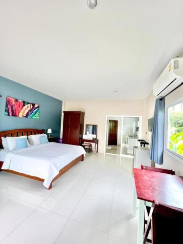 a bedroom with a large bed in a room at Lay Back Villa C2 with Kitchen & High speed Internet in Krabi
