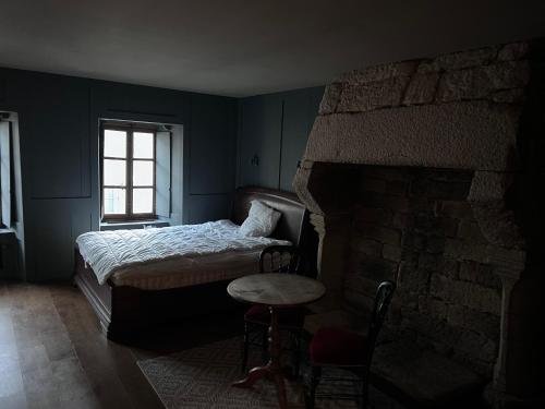 Кровать или кровати в номере Chambres d’hôtes en centre-ville