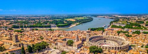 an aerial view of a city with a river at ibis budget Arles Sud Fourchon in Arles