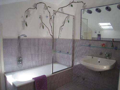 a bathroom with a shower and a sink and a mirror at Villa Formica - Vista su Castello di Gradara in Gradara