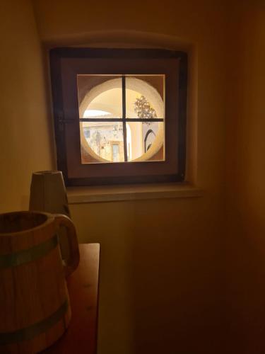 a window with a view of a building through it at B&B Genti delle Alture in Apice