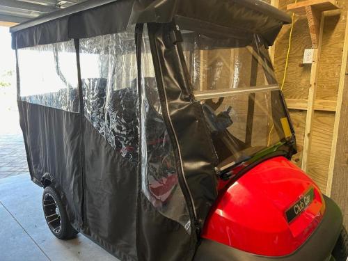 a golf cart with its door open in a garage at Jailbreak in Southport