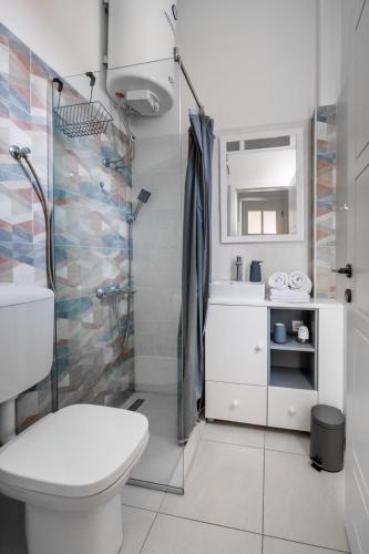 a bathroom with a toilet and a shower at Apartment Stay in Novi Sad